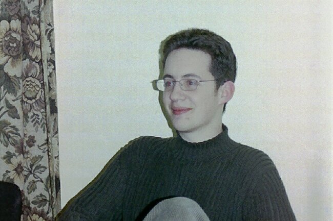 Owain wears a certain organ scholar's glasses